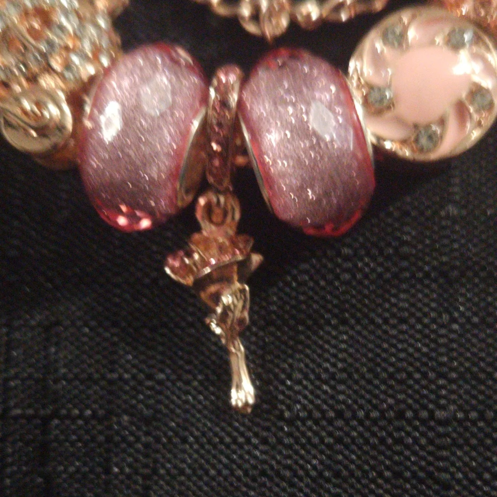 Gold and Pink Charm Bracelet with Ornate Charms. ITEM No. 19-144